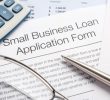 Close up of Small Business loan application Form with pen, calculator