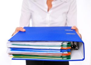 Blue Binder Presented by am Out-of-focus Business Woman